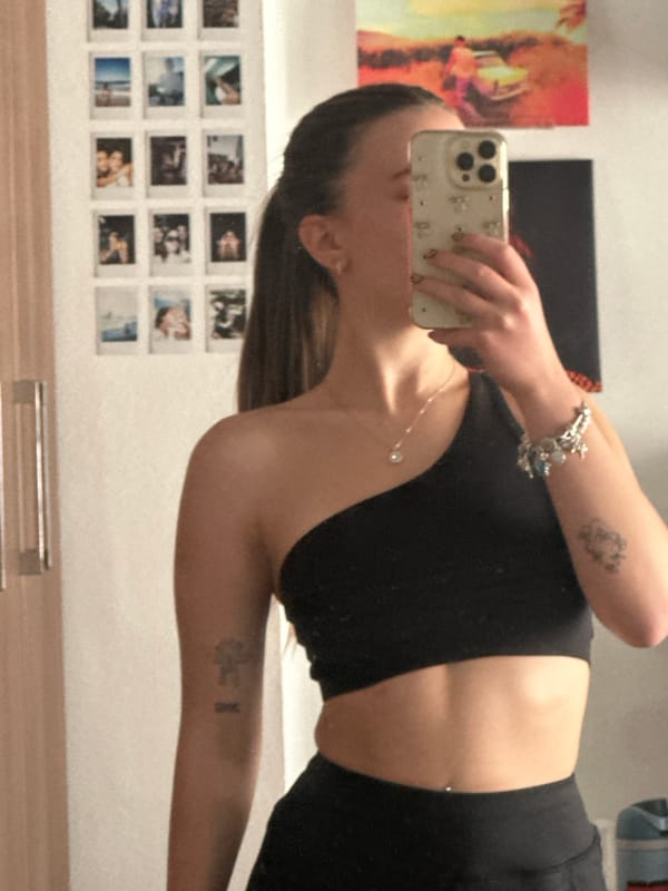 Woman takes mirror selfies in decorated room in Mexico