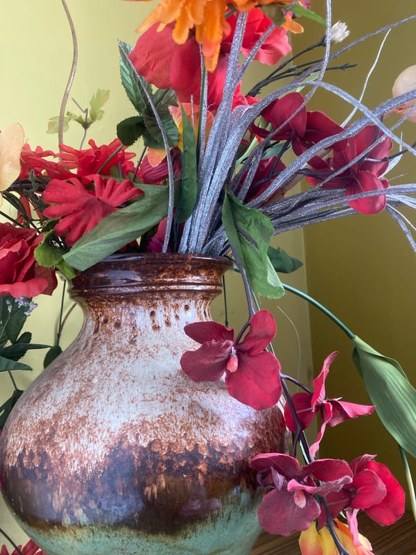 Indoor still lifes, decorative objects, and a parked Mustang outside