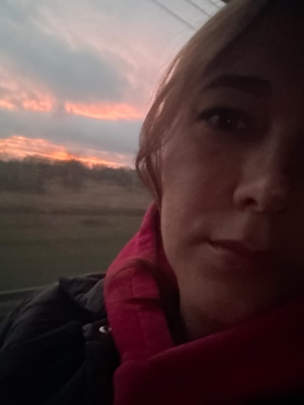 Person takes selfie at dawn in Russian village