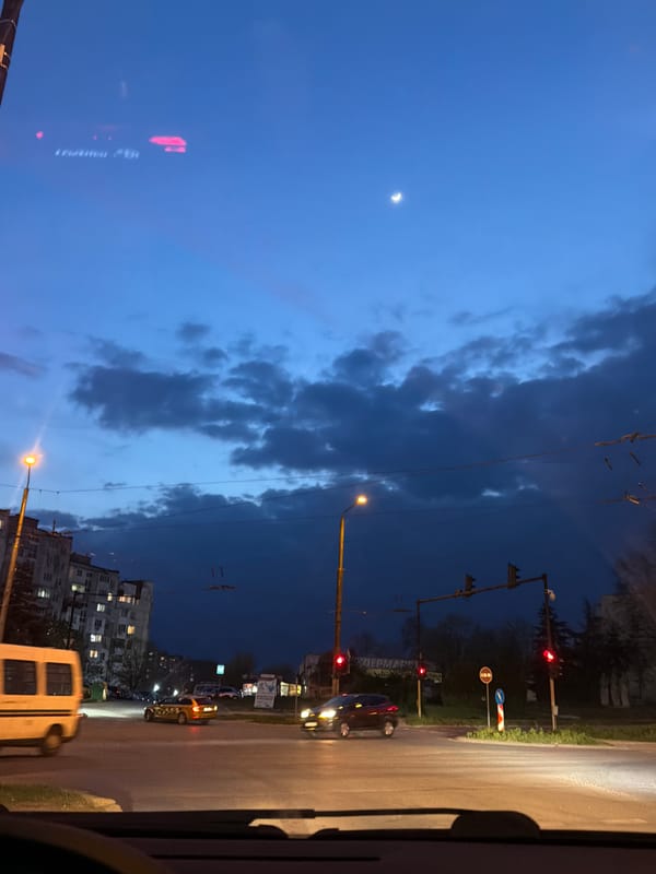 Dusk street scene observed from vehicle in Varna, Bulgaria