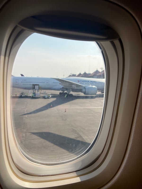 Ground operations and terminal views at Bali's DPS airport