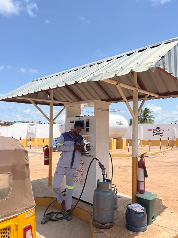 Gas station attendant serves customers in Ablekuma, Ghana