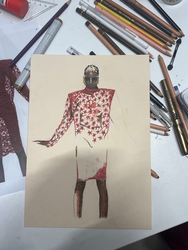 Fashion sketch spotted on Milan tabletop amid art supplies