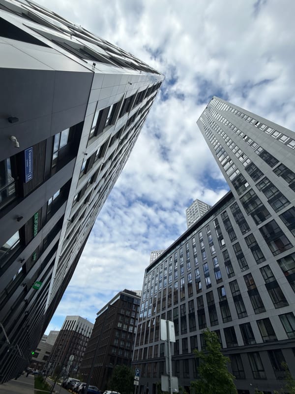 Morning architectural survey captures Moscow high-rises under cloudy skies