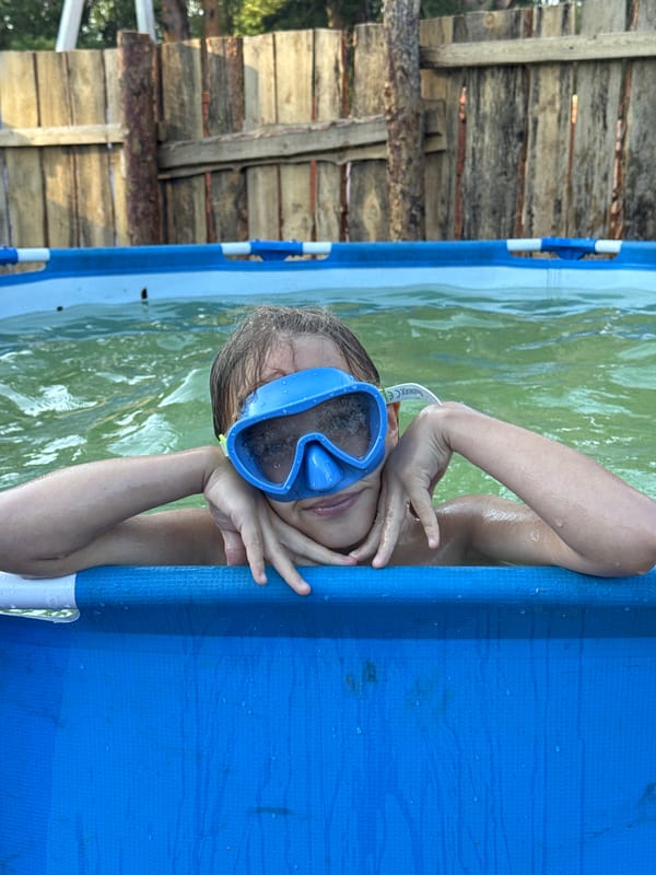 Backyard pool day with trampolining, splashing, and poolside selfies