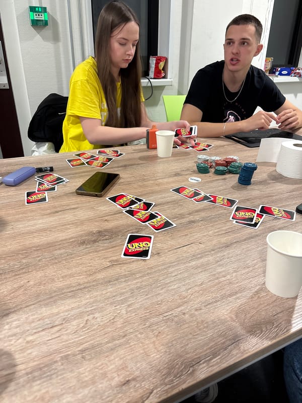 Young adults play UNO card game in Enschede