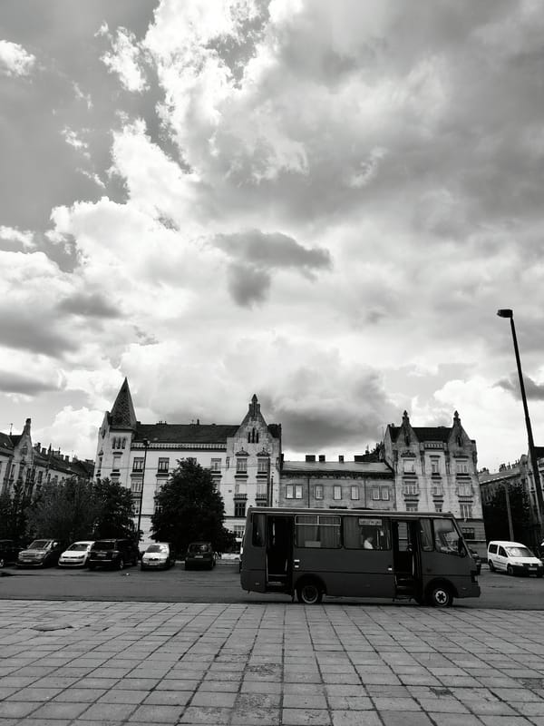 Lviv streets and landmarks under a stormy July sky