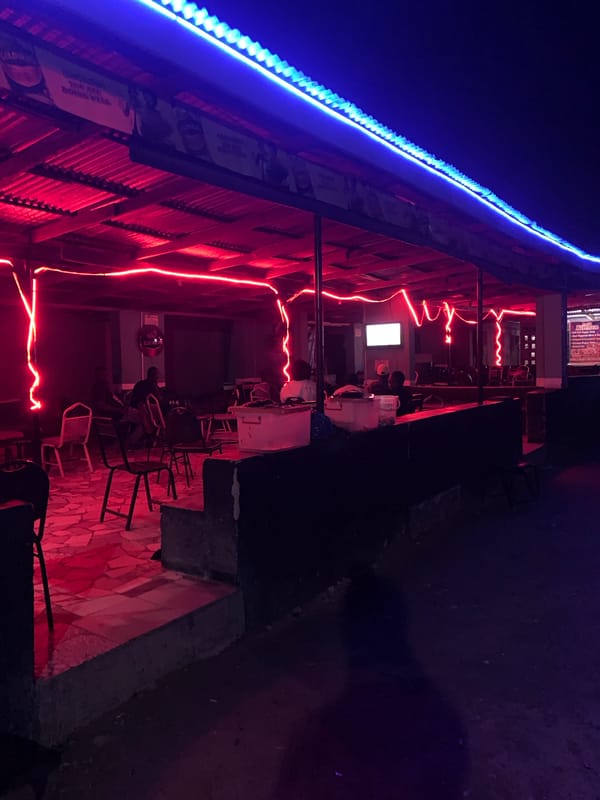 Nightlife scenes documented around New Stadium, Nigeria bar district