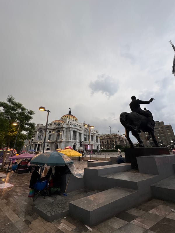 Mexico City's historic center amid market stalls and protest imagery