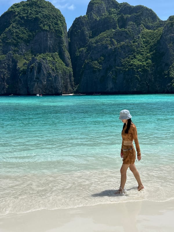 Strolling Ao Nang's turquoise shoreline in tropical summer heat