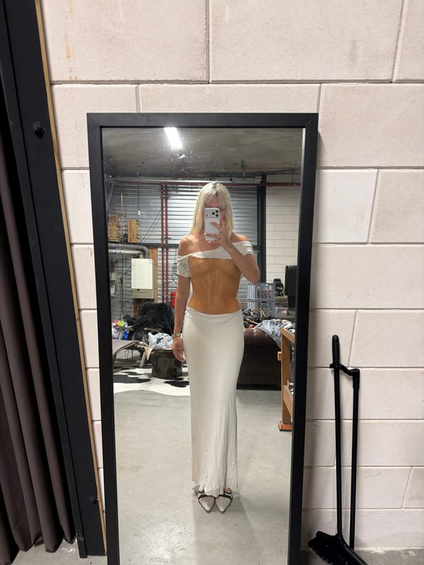 Mirror selfie and worn mannequin in an Amsterdam interior