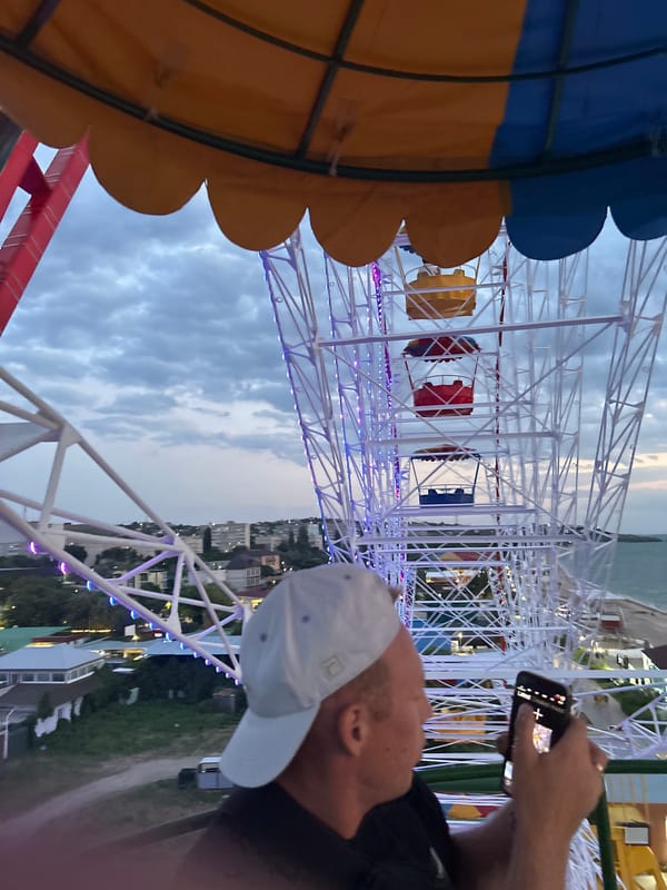 Dusk on the Azov coast: Ferris wheel rides and seafront strolls