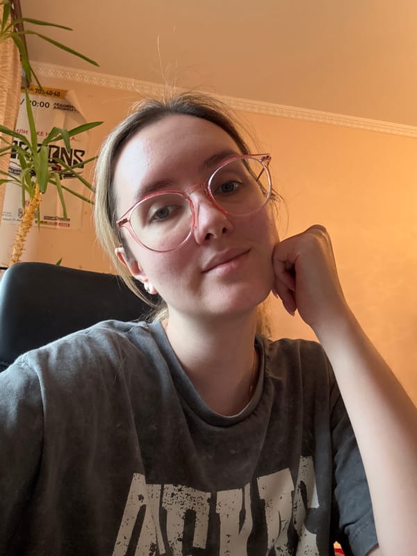Casual self-portrait session, pink glasses, indoor setting