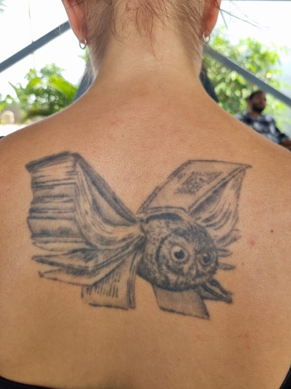 Tattoos and Hindu statue documented in Bangaliguda morning scene