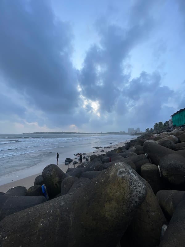 Mumbai's coastline under monsoon skies, tetrapods and rough seas