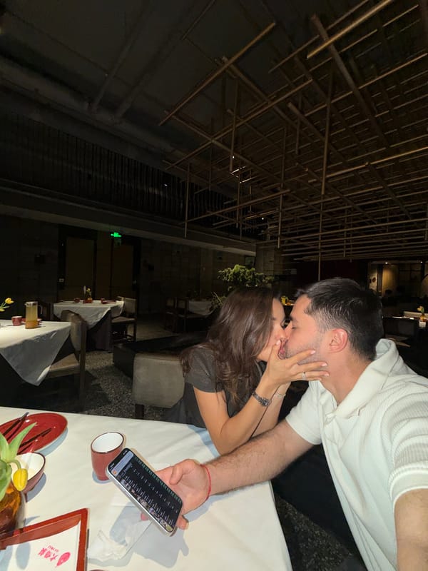 Woman documents restaurant visit with selfies in Beijing's Dongcheng District