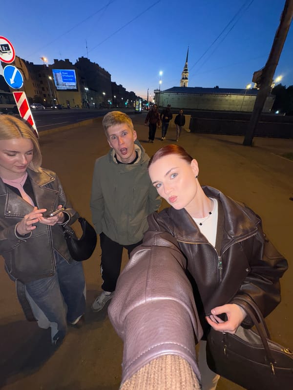 Dusk in Saint Petersburg: canals, street life, and parked cars