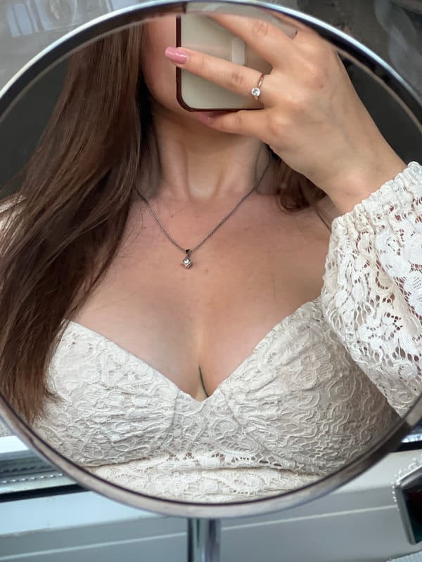 Woman takes mirror selfies with cat in Ternopil home