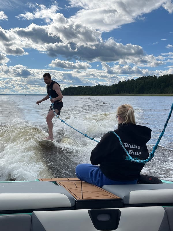 Wake surfing on calm water near Gromovo, Russia