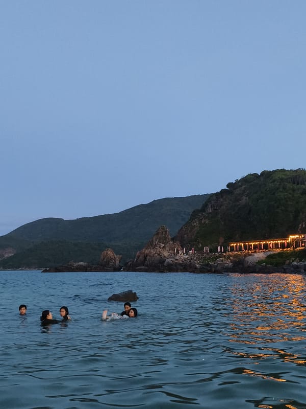 Families enjoy evening swim at Vĩnh Lương beach, Vietnam
