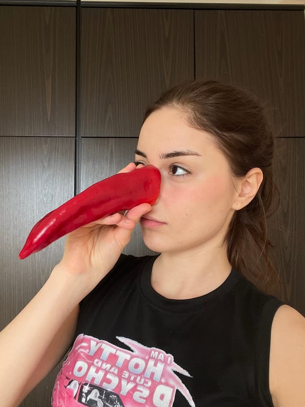 Woman attempts to play red bell pepper as instrument in Moscow