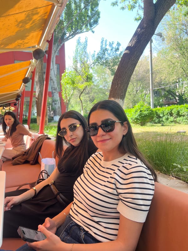 Midday cafe scene: patrons dining, socializing outdoors