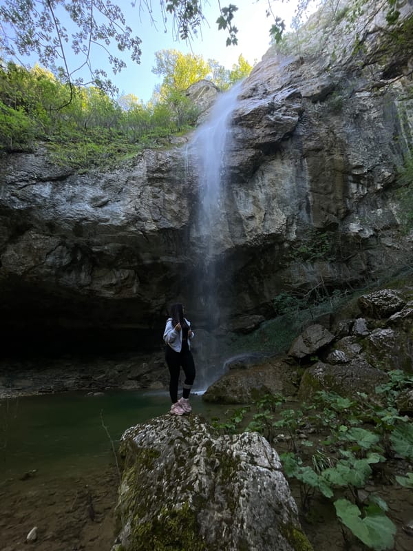 Visitors explore waterfall site in Veselinovo, Bulgaria