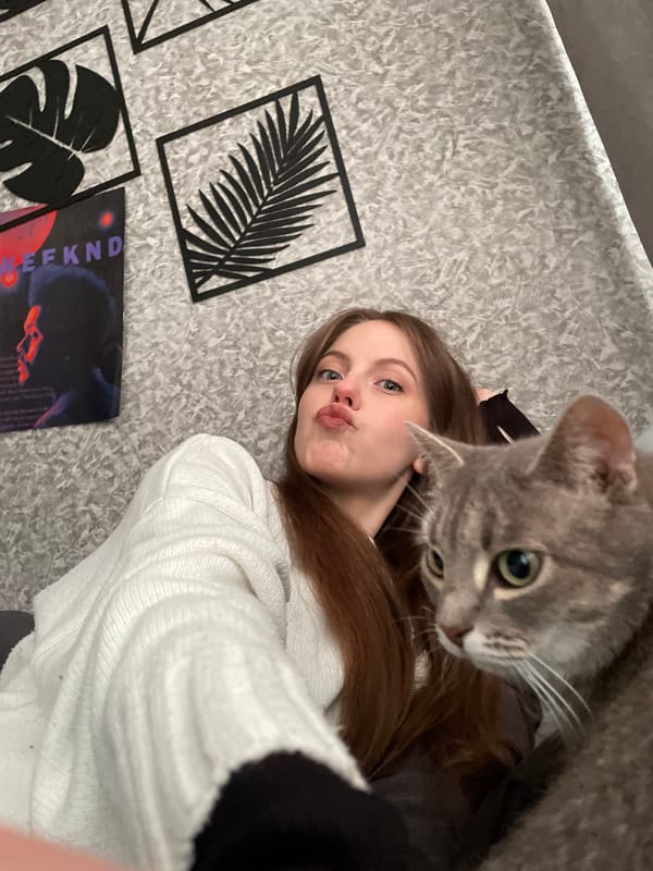 Woman takes selfies with cats in Russian home