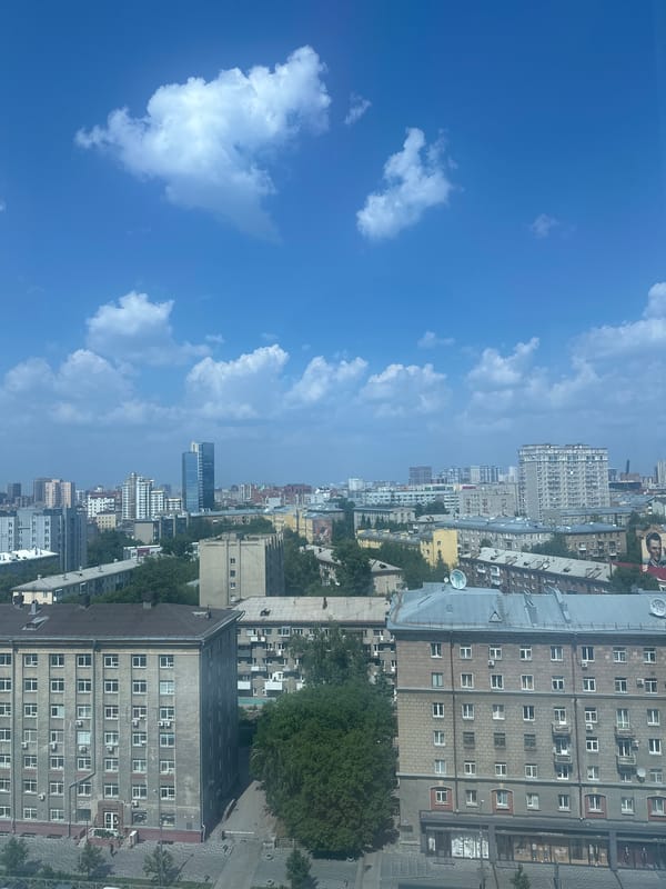 Aerial views over Novosibirsk's dense urban core on a clear morning