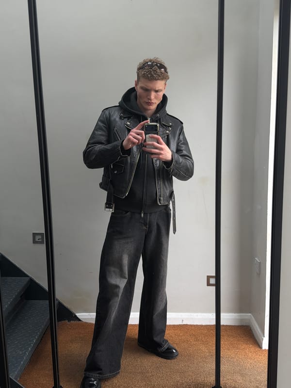 Man in leather jacket spotted in London mirror reflection