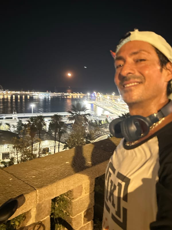 Nighttime selfie with Barcelona's cityscape as backdrop