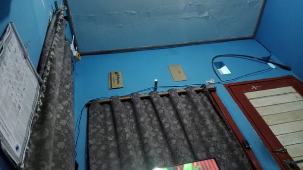 Hanging out in a blue-walled room in Denpasar, Bali