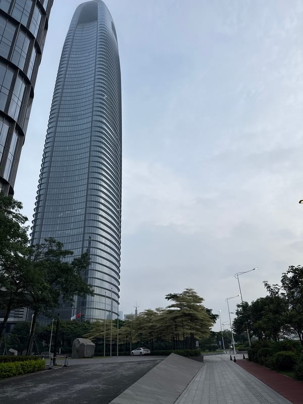 Exploring Haizhu District's modern urban core on a cloudy evening