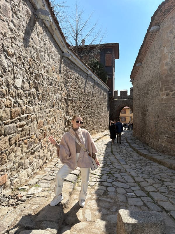 Woman walks cobblestone streets in historic Plovdiv Bulgaria