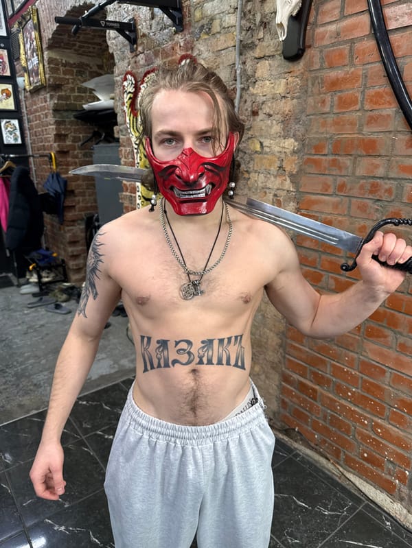 Masked individual with swords, tattoos photographed in Moscow