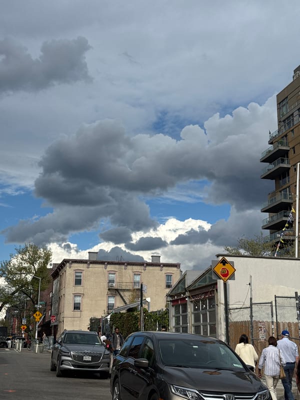 Storm clouds gather over New York City street scene