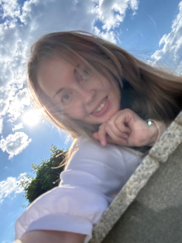 Young woman's casual afternoon selfie session captured in urban setting