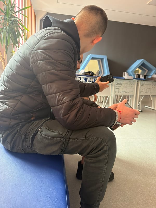 People gather indoors with smartphones in General Toshevo