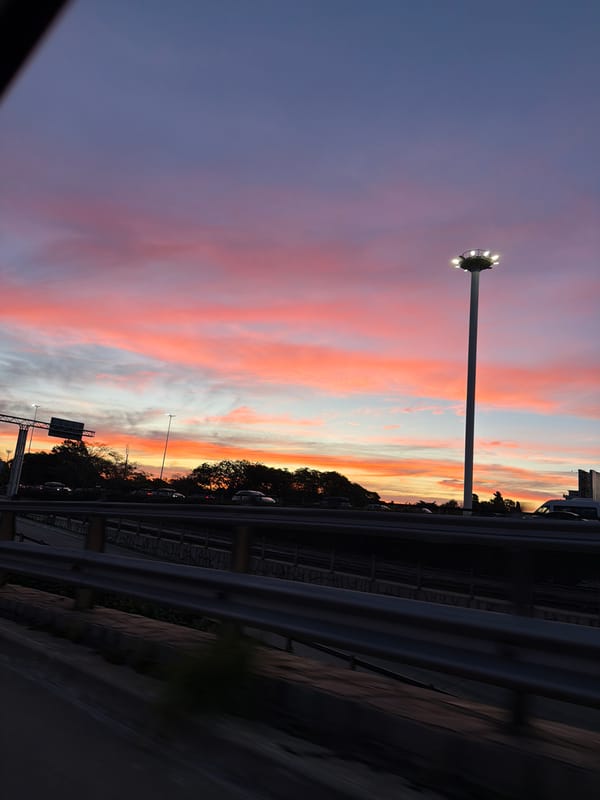 Colorful sunset observed over Buenos Aires highway