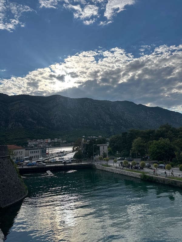 Tourist captures scenic views of Kotor Montenegro waterfront