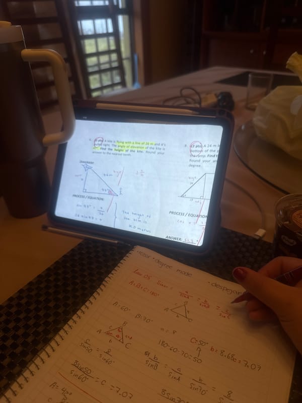 Student tackles trigonometry homework with chocolate dessert nearby