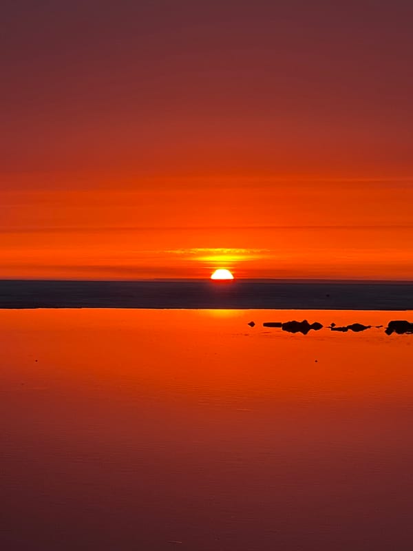 Evening sunset gathering draws people to Sestroretsk waterfront