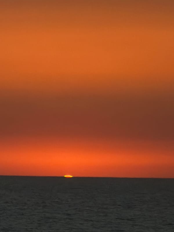 Sunset over Gaza waters captured by witnesses through windows