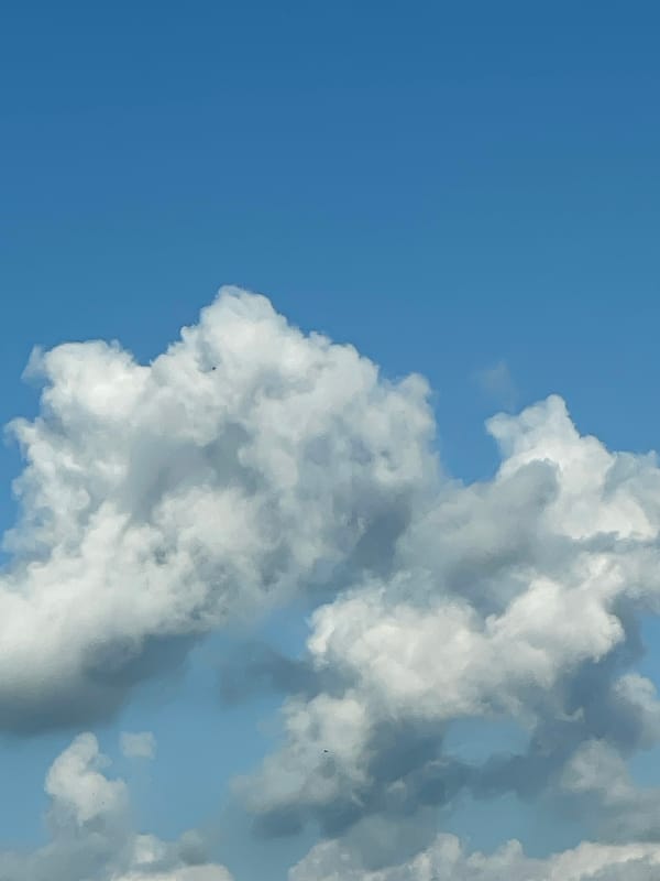 Afternoon clouds form face-like pattern over Dobrich, Bulgaria