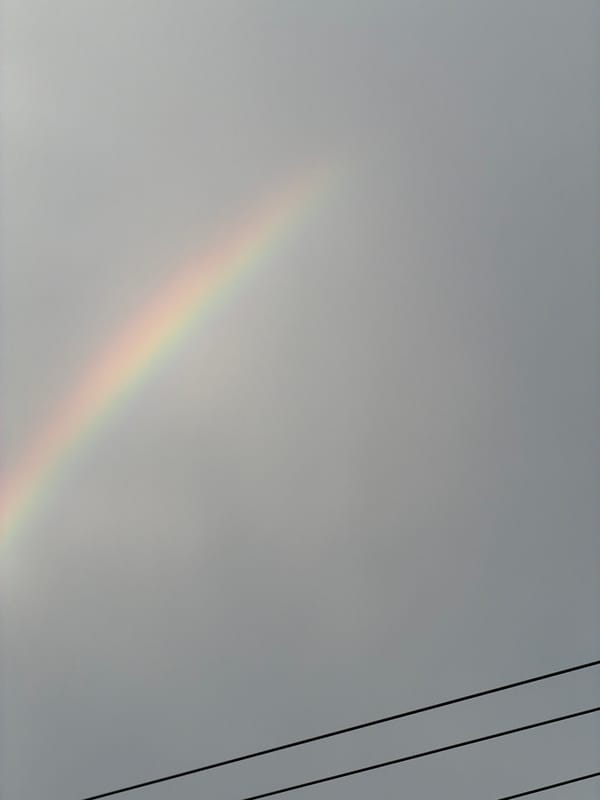 Faint rainbow spotted across multiple Vietnamese districts during overcast morning