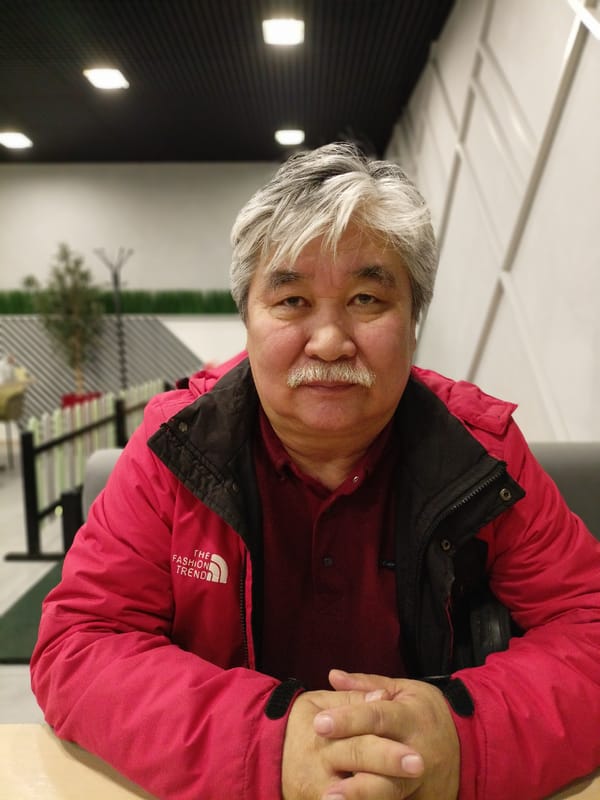 Man dining at Novosibirsk cafeteria during early morning hours