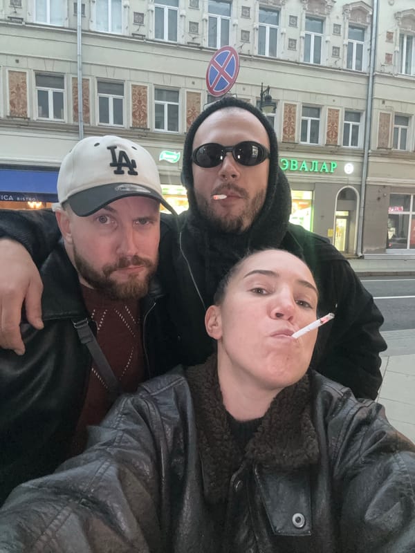Three people take selfie on Moscow street