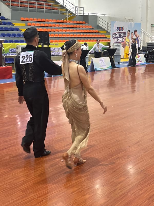 Ballroom dance competition underway on arena floor