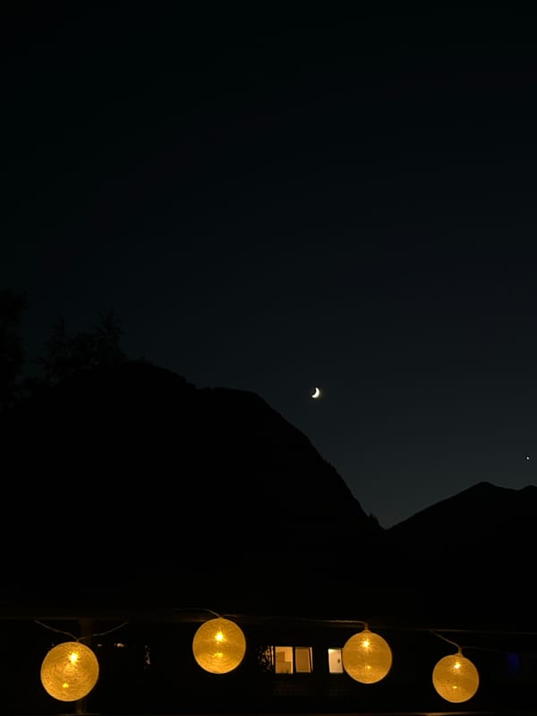 Summer twilight on a Garmisch terrace, Alps fading into night