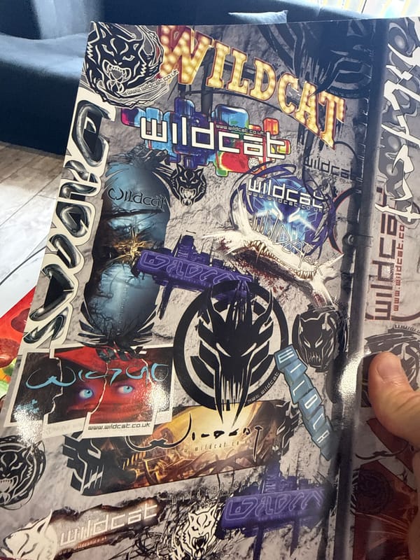Tattoo enthusiast browses magazines and studio materials in Sofia